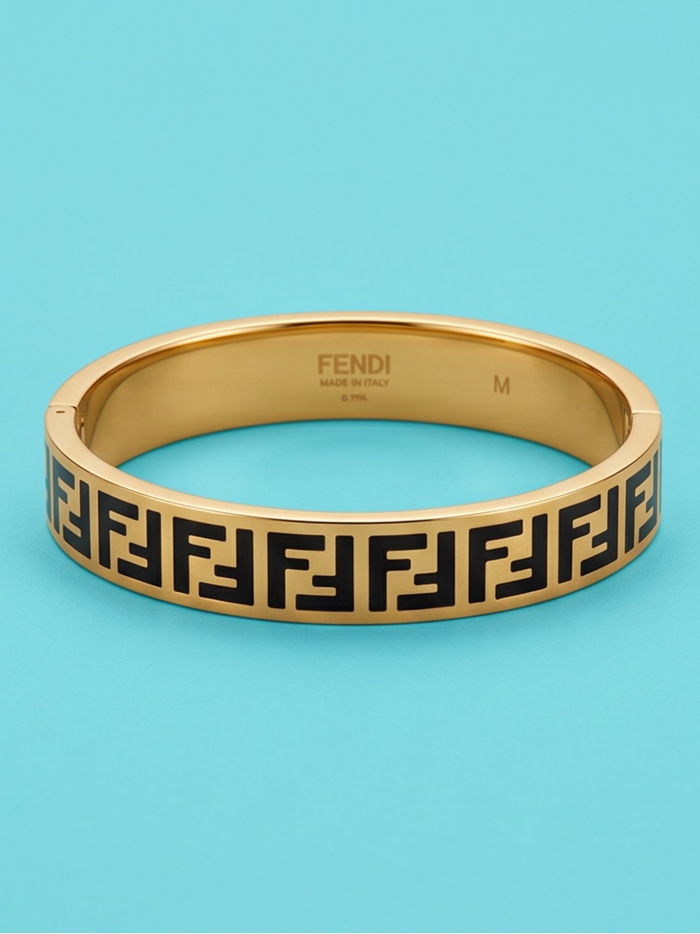 FOREVER FENDI
Gold-Tone Bangle with Black FF Motif